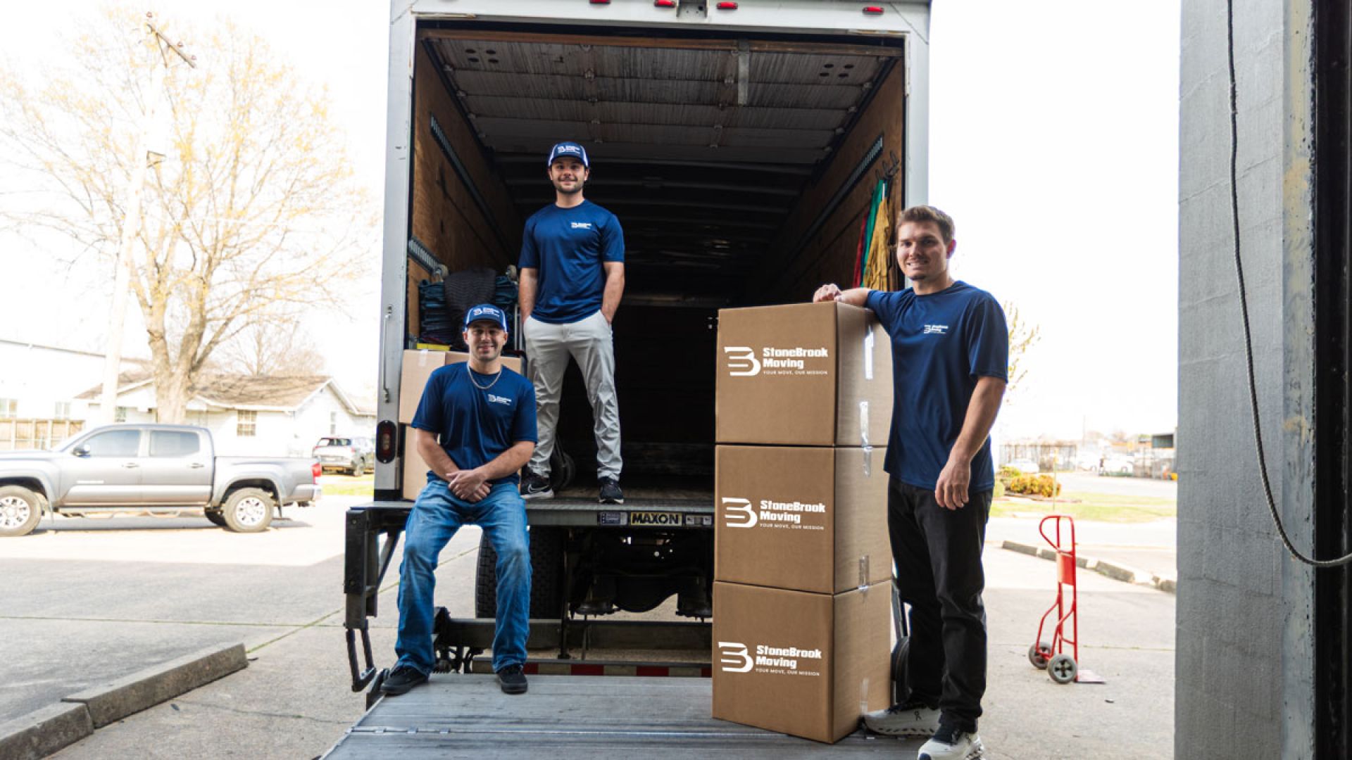 StoneBrook Moving employees on truck with boxes