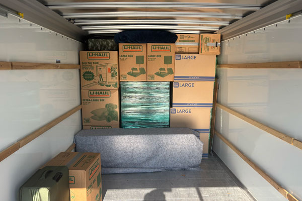 boxes loaded onto StoneBrook Moving truck